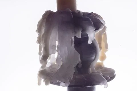 Candle dripping in a candlestick Stock Photos