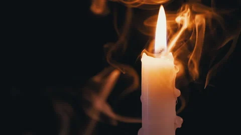 Candle, with Dripping Wax, Burns in a Cloud of Smoke on Black Background Video stock 153834987