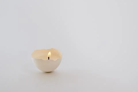 Candle in eggshell Stock Photos