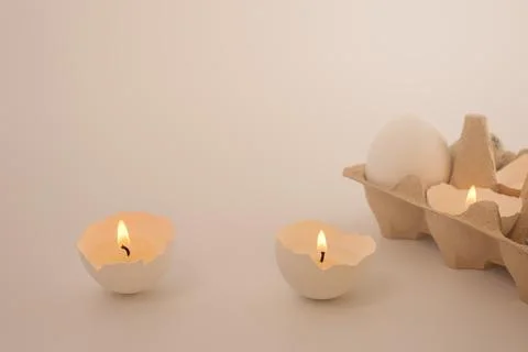 Candle in eggshell Stock Photos