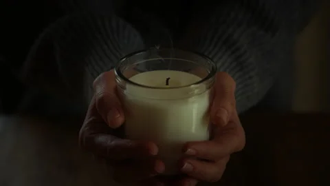 Candle in female hands Video stock 236948718