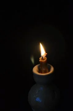 Candle fire in the dark Stock Photos