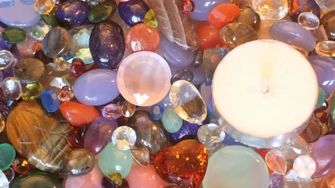 Candle fire set up top view with precious gemstones surface zoom Stock Footage 76121067