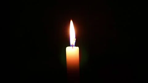 Candle flame against isolated black background Stock Footage 199746387