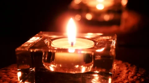 Candle flame and its reflection glowing Stock Footage 35485977