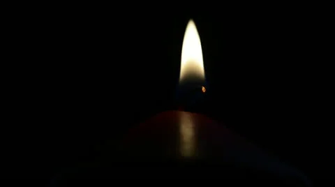 Candle flame on a black background Stock Footage 21725269
