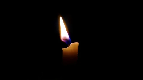 Candle Flame Blowing in Breeze Stock Footage 84703129