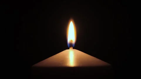 Candle flame is burning in dark Video stock 304743258