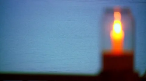 Candle flame burns inside of candle holder Stock Footage 54591481
