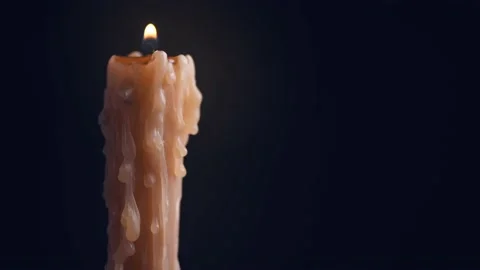 Candle flame close up on a dark background. Candle light border design Stock Footage 163670864