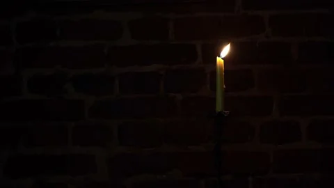 Candle flame close-up on a dark background. Stock Footage 171085571