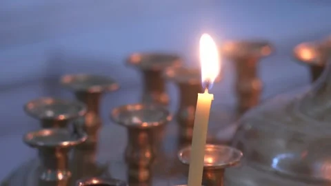 Candle flame close up on a dark background. Video stock 172062990