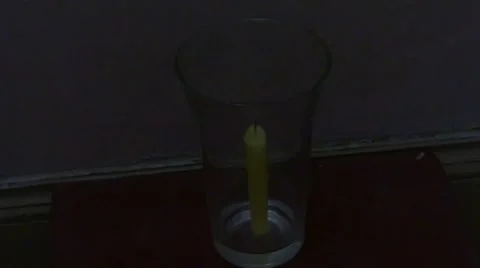 Candle flame (close-up) : How long a candle can survive into a closed glass? Stock Footage 41697253