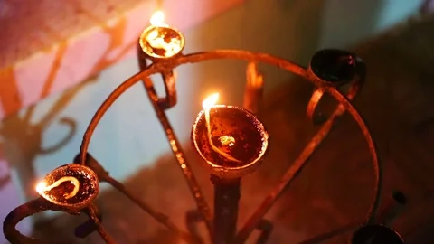 Candle flame close-up in the Indian Temple on a Religious Festival Diwali. .. Stock-Footage 74875661