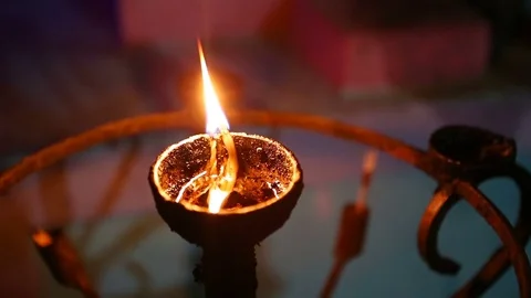 Candle flame close-up in the Indian Temple on a Religious Festival Diwali. .. Stock-Footage 74875669