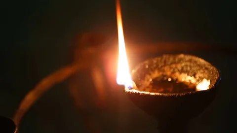Candle flame close-up in the Indian Temple on a Religious Festival Diwali. .. Stock-Footage 74875685