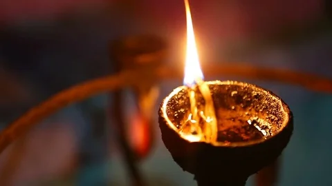 Candle flame close-up in the Indian Temple on a Religious Festival Diwali. .. Stock-Footage 74875725