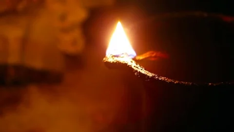 Candle flame close-up in the Indian Temple on a Religious Festival Diwali. Oi Video stock 77717197