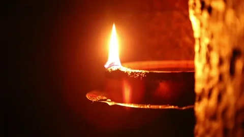 Candle flame close-up in the Indian Temple on a Religious Festival Diwali. Oi Video stock 77717211