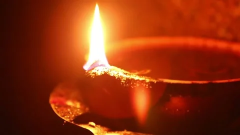 Candle flame close-up in the Indian Temple on a Religious Festival Diwali. Oi Stock Footage 77717234
