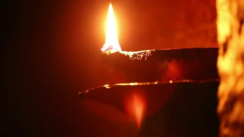 Candle flame close-up in the Indian Temple on a Religious Festival Diwali. Oi Video stock 77717291