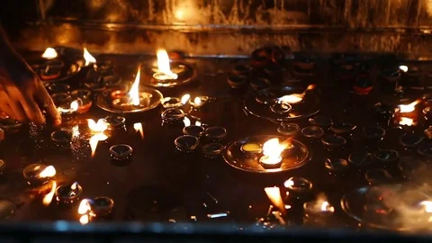 Candle flame close-up in the Indian Temple on a Religious Festival Diwali. Oi Video stock 77717797