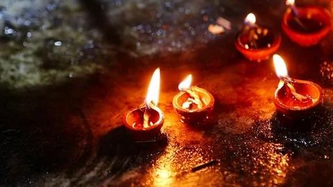 Candle flame close-up in the Indian Temple on a Religious Festival Diwali. Oi Video stock 77717845