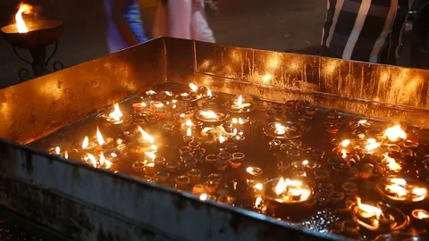 Candle flame close-up in the Indian Temple on a Religious Festival Diwali. Oi Video stock 77717849