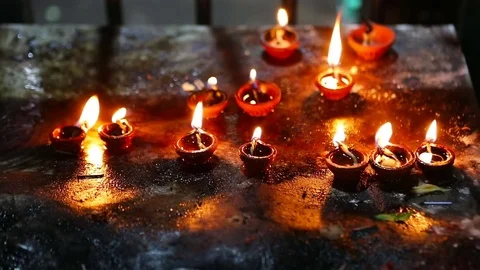 Candle flame close-up in the Indian Temple on a Religious Festival Diwali. Oi Video stock 77717858