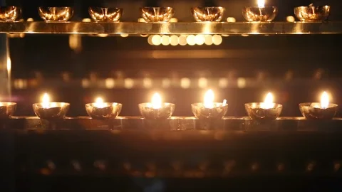 Candle flame close-up. Many Candles in a Buddhist temple. Religious Festival. Stock Footage 88133030