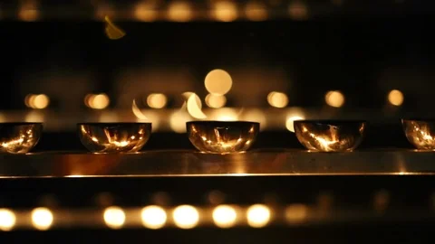 Candle flame close-up. Many Candles in a Buddhist temple. Religious Festival. Stock Footage 88133103