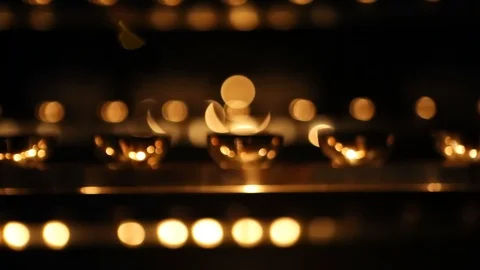 Candle flame close-up. Many Candles in a Buddhist temple. Religious Festival. Stock Footage 88133117