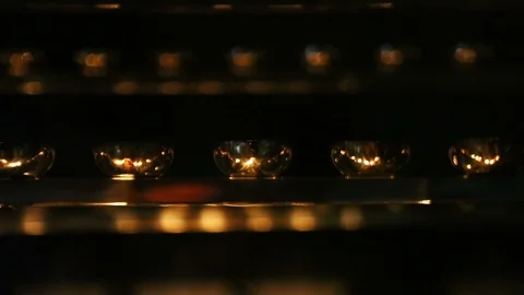 Candle flame close-up. Many Candles in a Buddhist temple. Religious Festival. Stock Footage 88133268