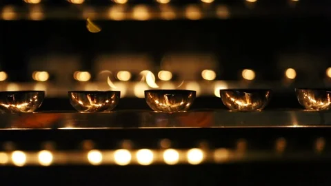 Candle flame close-up. Many Candles in a Buddhist temple. Religious Festival. Stock Footage 88133276