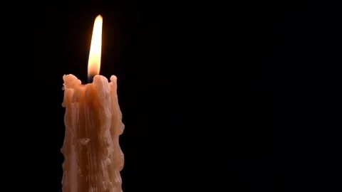 Candle flame close up over dark background. Candle light border design 動画素材 329568100