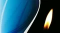 Candle flame closeup with silk background HD Footage