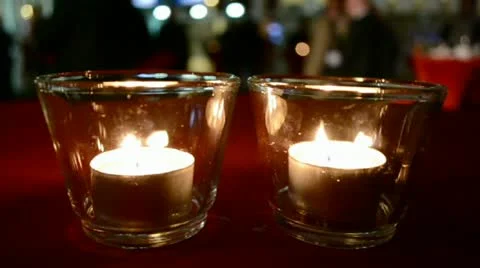 Candle flame closeup on the table, romantic interior diversity. Video stock 21264616