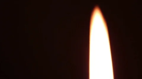 A candle flame on a dark background. macro shooting Stock Footage 81580657