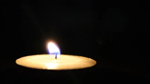 Candle flame in the dark, burning candle with black background Stock Footage 134696460