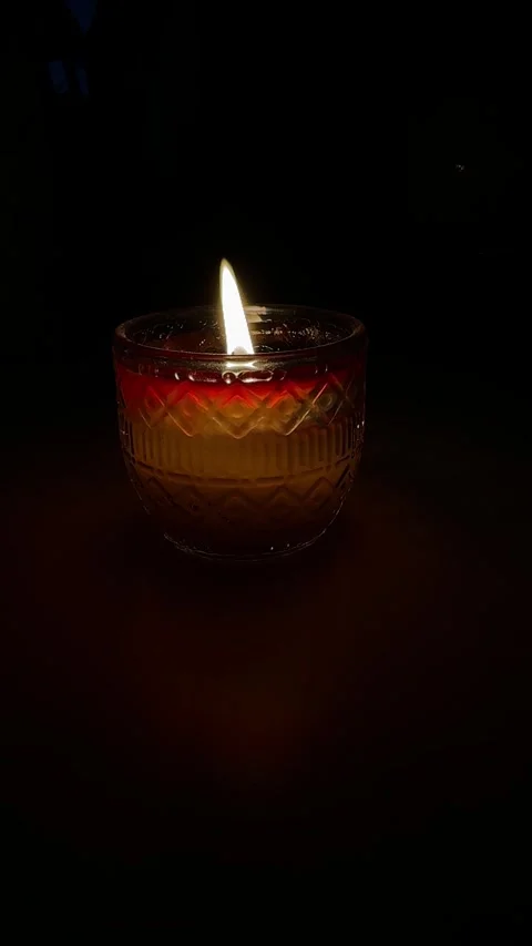 Candle flame in a dark environment Stock Footage 303423412