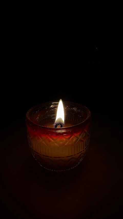 Candle flame in a dark environment Stock Footage 303423413