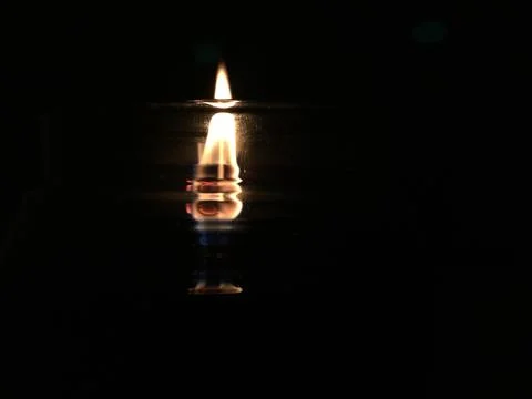 Candle Flame in the Dark Stock Photos