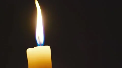 Candle flame in darkness Stock Footage 132444695