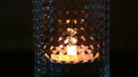 The candle flame flickers in the glass. Close-up of a glass with candles inside Stock Footage 214337670