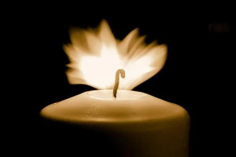 Candle flame in memory of all the victims of coronavirus Stock Photos