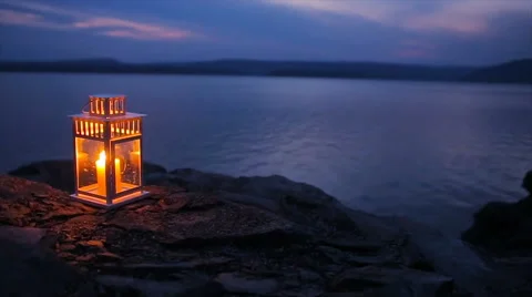 Candle flame shines on the lake Stock Footage 63746891