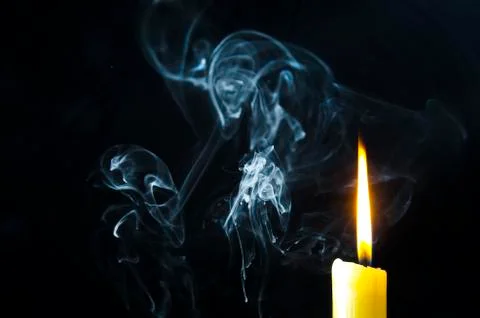 Candle, flame, smoke. Stock Photos