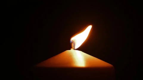 Candle flame sways in dark in wind 스톡 동영상 310800500