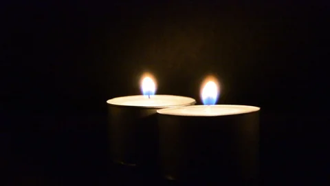 Candle flames at night closeup soft focus Video stock 126718141