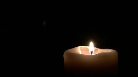 Candle Flickering in a Dark Room Stock Footage